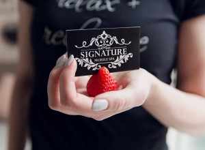 esthetician at a teen spa party holding a strawberry